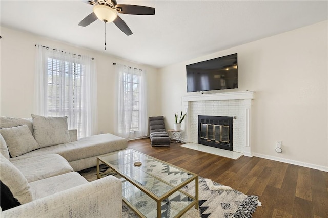 5910 Abilene Trl, Austin, TX 78749 - living area featuring a ceiling fan, wood finished floors, and a brick fireplace