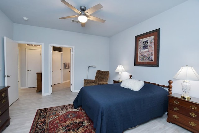 106 Bass St, Georgetown, TX 78633 - bedroom with light wood finished floors and ceiling fan