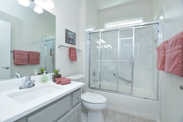 106 Bass St, Georgetown, TX 78633 - bathroom featuring vanity and combined bath / shower with glass door