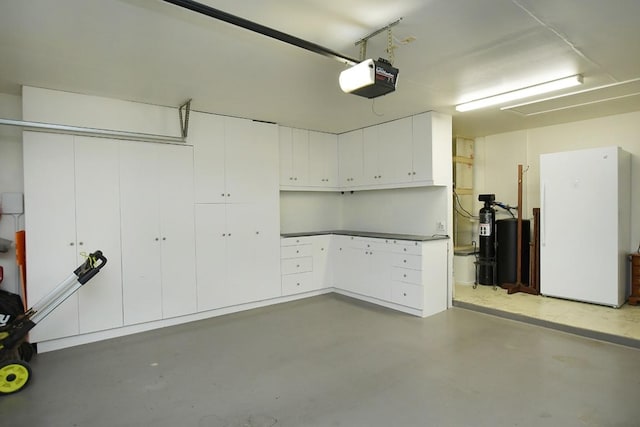 106 Bass St, Georgetown, TX 78633 - garage with freestanding refrigerator and a garage door opener