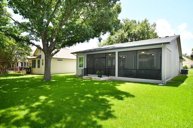 106 Bass St, Georgetown, TX 78633 - back of property featuring a sunroom and a lawn