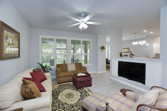 106 Bass St, Georgetown, TX 78633 - living area featuring light wood finished floors, ceiling fan, and recessed lighting