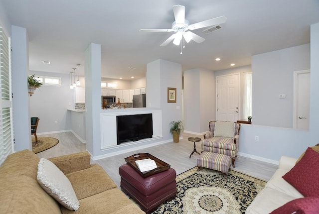 106 Bass St, Georgetown, TX 78633 - living area featuring ceiling fan, recessed lighting, and light wood finished floors