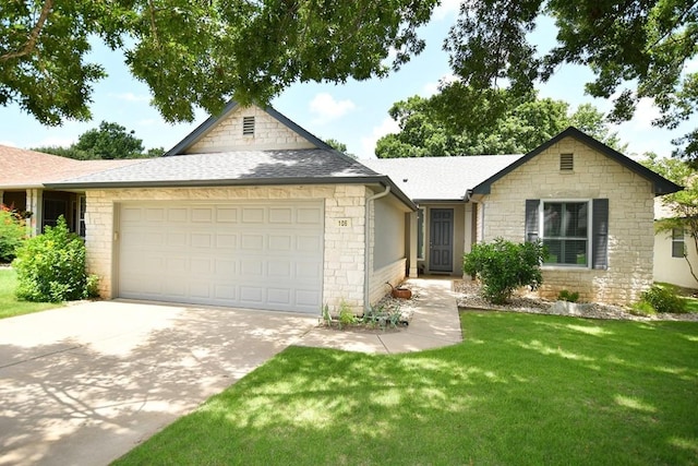 106 Bass St, Georgetown, TX 78633 - view of front of house featuring an attached garage, stone siding, and driveway