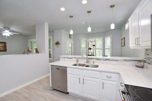 106 Bass St, Georgetown, TX 78633 - kitchen with stainless steel dishwasher, backsplash, a peninsula, range with electric stovetop, and recessed lighting