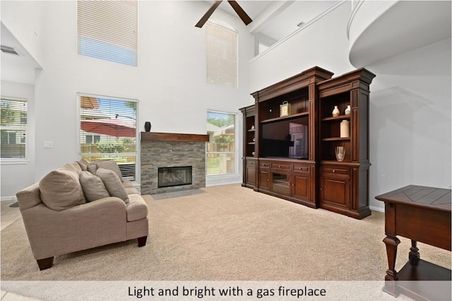 8300 Fern Bluff Ave, Round Rock, TX 78681 - living area with carpet flooring, ceiling fan, high vaulted ceiling, a fireplace, and beam ceiling