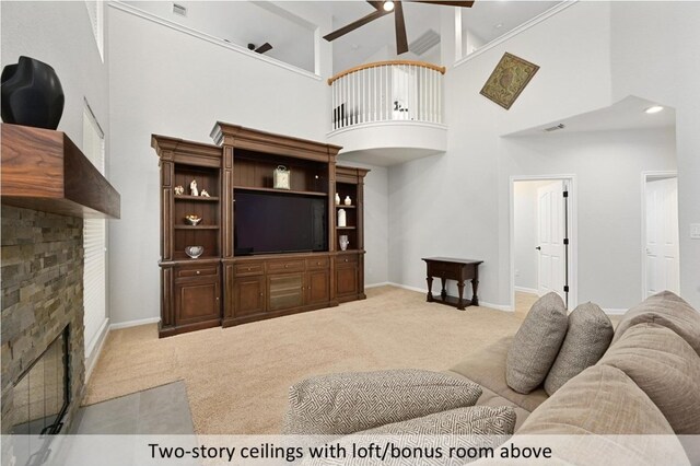 8300 Fern Bluff Ave, Round Rock, TX 78681 - carpeted living area with a fireplace with flush hearth, ceiling fan, and a towering ceiling