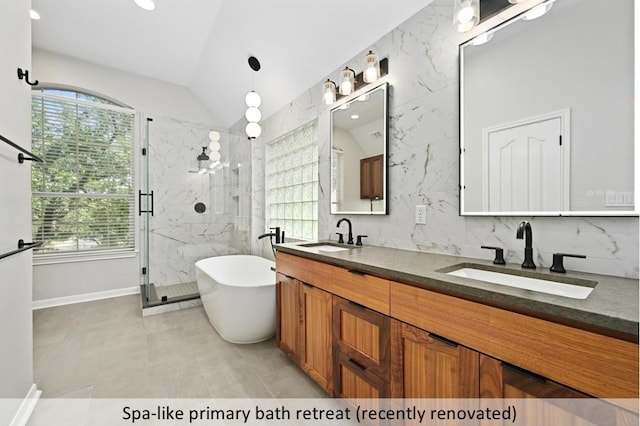 8300 Fern Bluff Ave, Round Rock, TX 78681 - bathroom with a marble finish shower, plenty of natural light, double vanity, a freestanding bath, and lofted ceiling