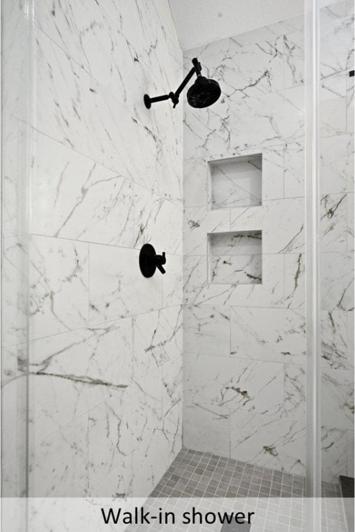 8300 Fern Bluff Ave, Round Rock, TX 78681 - bathroom featuring a marble finish shower
