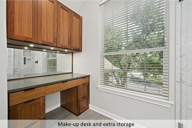 8300 Fern Bluff Ave, Round Rock, TX 78681 - unfurnished office with plenty of natural light, light tile patterned flooring, and built in desk