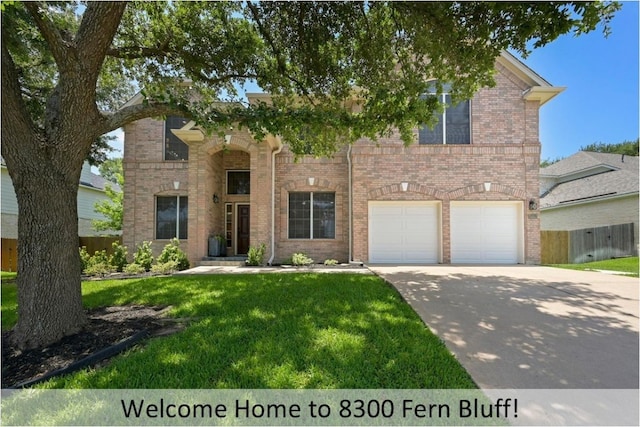 8300 Fern Bluff Ave, Round Rock, TX 78681 - view of front of home with an attached garage, concrete driveway, and brick siding
