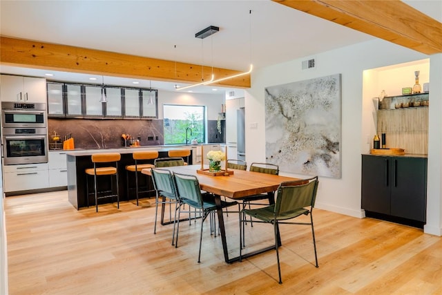 4407 Ganymede Dr, Austin, TX 78727 - dining space with light wood-style floors and recessed lighting
