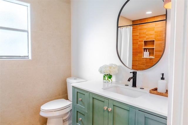 4407 Ganymede Dr, Austin, TX 78727 - full bath with vanity, tile walls, and a shower with curtain