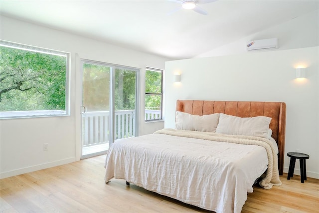 4407 Ganymede Dr, Austin, TX 78727 - bedroom featuring access to exterior, a wall mounted air conditioner, light wood finished floors, vaulted ceiling, and ceiling fan