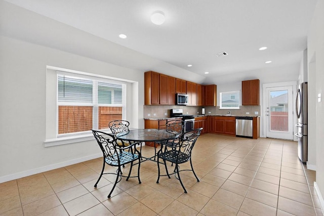 7619 Europa Ave, Round Rock, TX 78665 - dining area featuring light tile patterned floors and recessed lighting