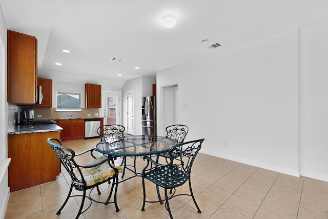 7619 Europa Ave, Round Rock, TX 78665 - dining space with recessed lighting and light tile patterned flooring