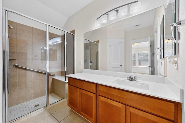 7619 Europa Ave, Round Rock, TX 78665 - bathroom with vanity, a stall shower, and tile patterned floors