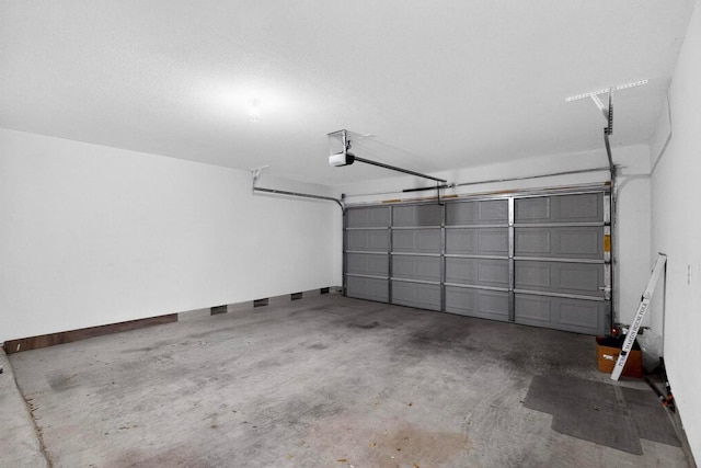 7619 Europa Ave, Round Rock, TX 78665 - garage with a garage door opener and baseboards