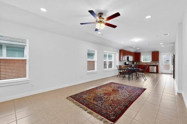 7619 Europa Ave, Round Rock, TX 78665 - dining area featuring light tile patterned floors, ceiling fan, and recessed lighting