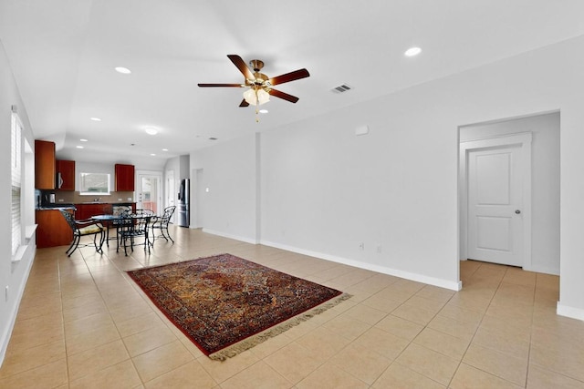 7619 Europa Ave, Round Rock, TX 78665 - living room with light tile patterned floors, ceiling fan, and recessed lighting