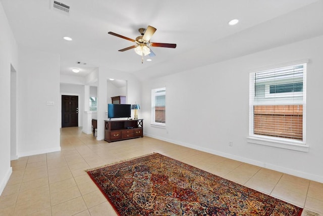 7619 Europa Ave, Round Rock, TX 78665 - living room with light tile patterned flooring, healthy amount of natural light, a ceiling fan, and recessed lighting