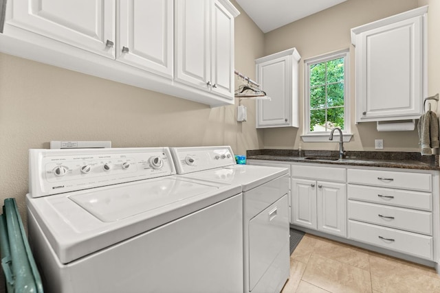 9 Borello Dr Unit 9, Austin, TX 78738 - laundry area featuring washing machine and clothes dryer, cabinet space, and light tile patterned flooring