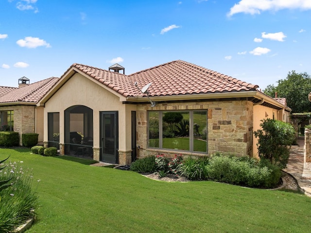 9 Borello Dr Unit 9, Austin, TX 78738 - rear view of house with stone siding, a yard, a tiled roof, and stucco siding