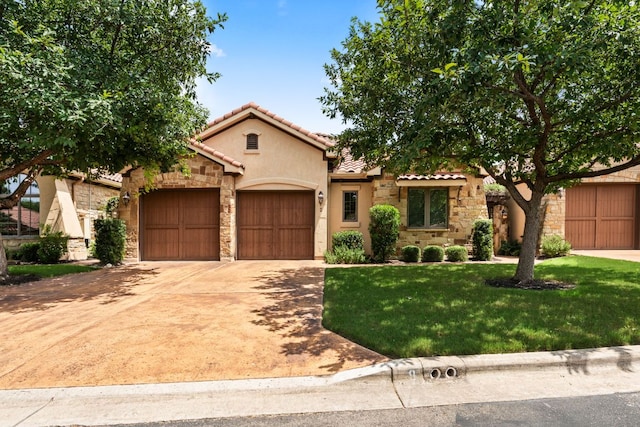 9 Borello Dr Unit 9, Austin, TX 78738 - mediterranean / spanish home featuring stone siding, an attached garage, concrete driveway, and stucco siding