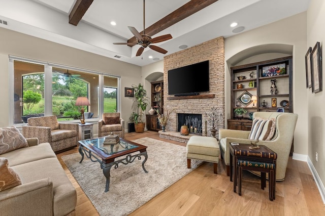 9 Borello Dr Unit 9, Austin, TX 78738 - living area featuring a ceiling fan, light wood finished floors, beam ceiling, recessed lighting, and a stone fireplace