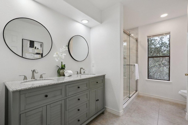 12706 Shemya Cv, Austin, TX 78729 - full bathroom with double vanity, a stall shower, recessed lighting, and tile patterned floors