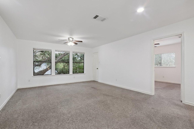 12706 Shemya Cv, Austin, TX 78729 - carpeted empty room with a ceiling fan and healthy amount of natural light