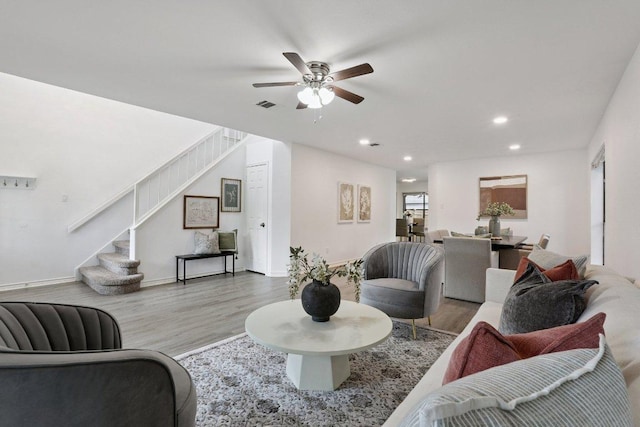 12706 Shemya Cv, Austin, TX 78729 - living area featuring stairway, wood finished floors, recessed lighting, and ceiling fan