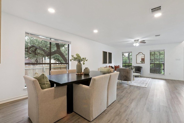 12706 Shemya Cv, Austin, TX 78729 - dining space with light wood-style floors, a ceiling fan, and recessed lighting