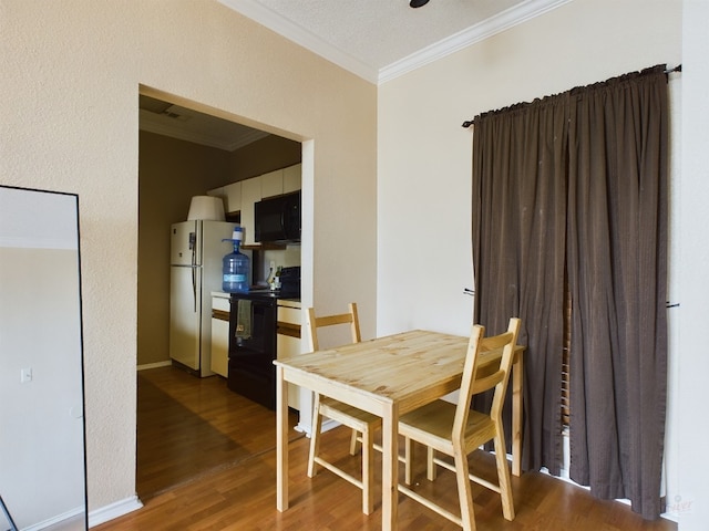 2804 Rio Grande St Unit 308, Austin, TX 78705 - dining room with ornamental molding and wood finished floors