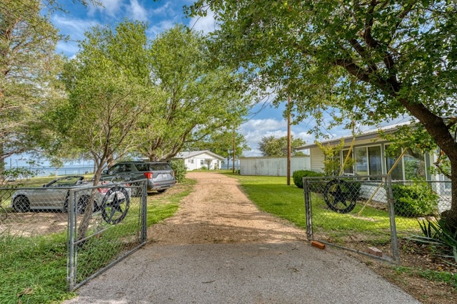 106 Chuckwagon, Burnet, TX 78611 - view of yard with a gate and dirt driveway