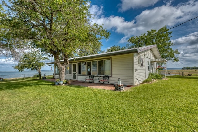 106 Chuckwagon, Burnet, TX 78611 - rear view of property with a patio and a water view