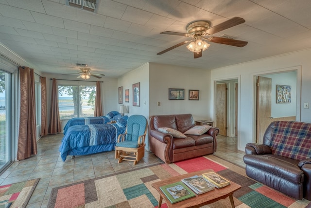 106 Chuckwagon, Burnet, TX 78611 - living area featuring a ceiling fan and light tile patterned floors
