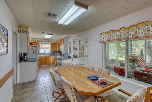 106 Chuckwagon, Burnet, TX 78611 - dining room with ornamental molding and light tile patterned floors