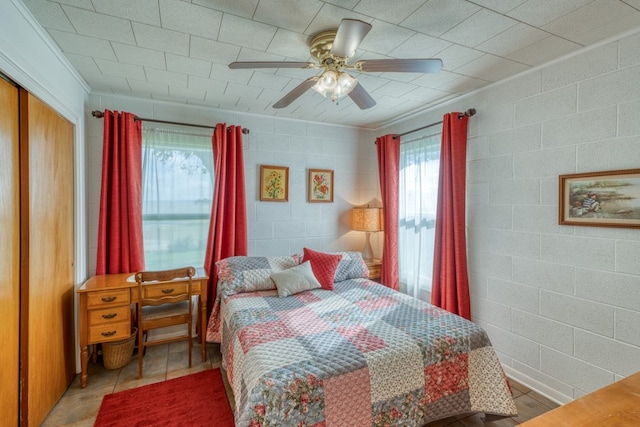 106 Chuckwagon, Burnet, TX 78611 - bedroom with a closet, ceiling fan, and light tile patterned floors