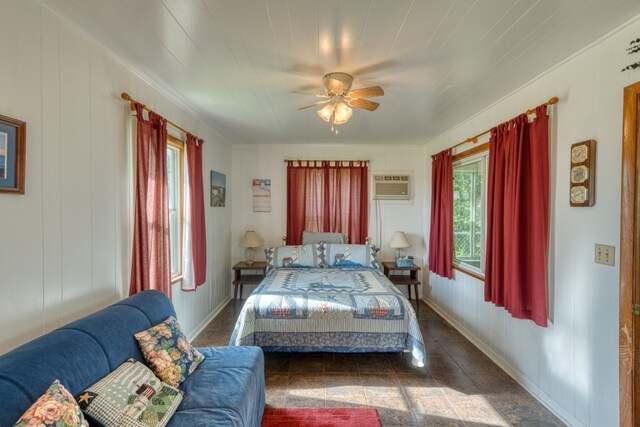 106 Chuckwagon, Burnet, TX 78611 - bedroom with a wall unit AC and ceiling fan