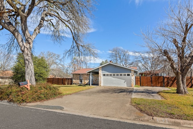 1602 Plateau Rdg, Cedar Park, TX 78613 - view of front facade featuring an attached garage, driveway, stone siding, and a chimney