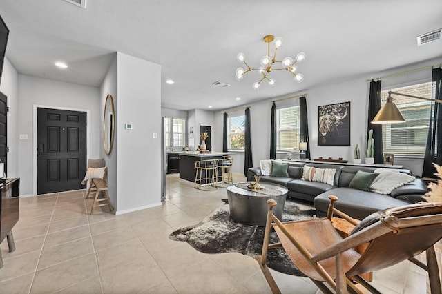 244 Fabion St, Kyle, TX 78640 - living room featuring light tile patterned floors, a chandelier, and recessed lighting