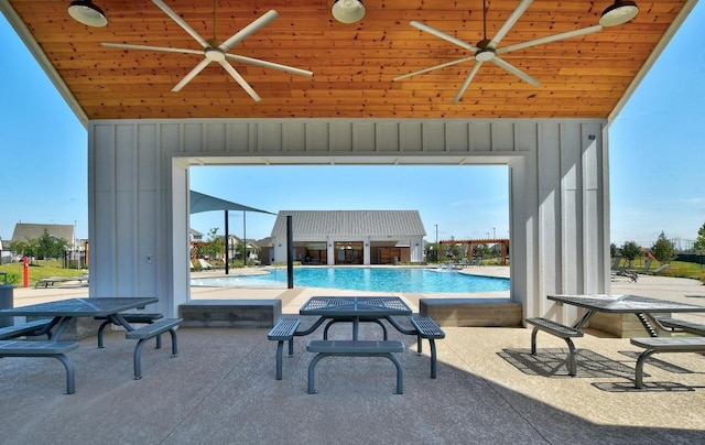244 Fabion St, Kyle, TX 78640 - community pool with ceiling fan and a patio