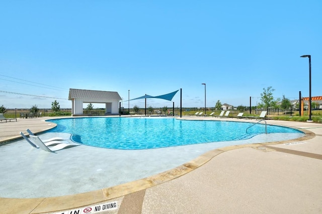 244 Fabion St, Kyle, TX 78640 - community pool with a patio area
