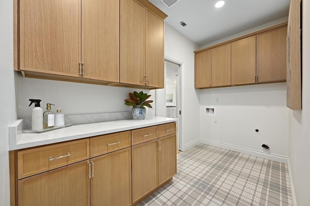 8902 Rustic Cv, Austin, TX 78717 - washroom featuring cabinet space, electric dryer hookup, washer hookup, and light tile patterned flooring