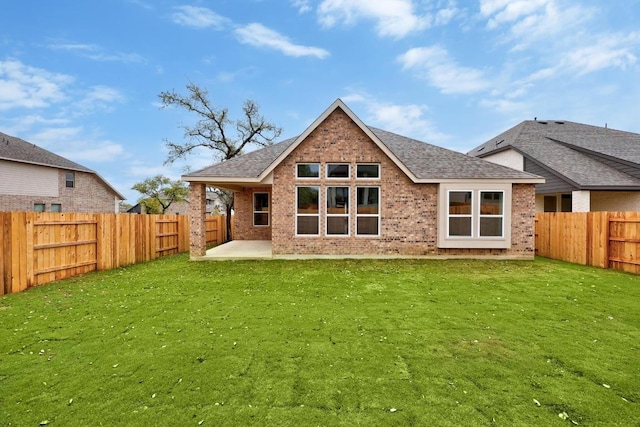 5904 Kelly Kyle Ave, Georgetown, TX 78628 - rear view of house featuring brick siding, a patio, a fenced backyard, and a shingled roof