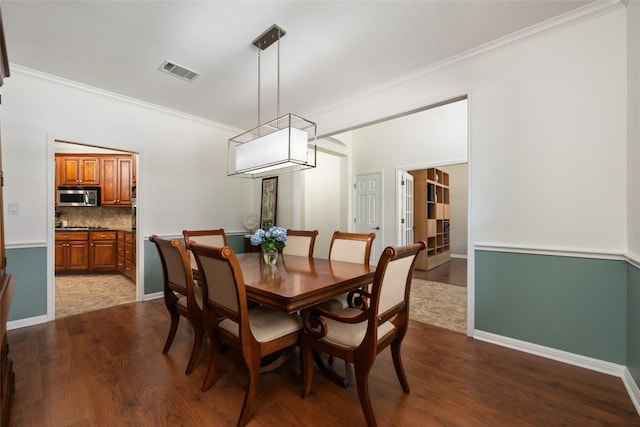 2500 Melekhin Bnd, Cedar Park, TX 78613 - dining space with ornamental molding and dark wood-style floors
