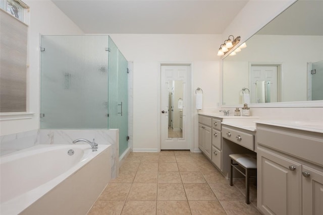 2500 Melekhin Bnd, Cedar Park, TX 78613 - full bathroom with vanity, a shower stall, a garden tub, and tile patterned floors