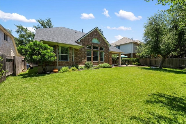 2500 Melekhin Bnd, Cedar Park, TX 78613 - back of house featuring a fenced backyard, brick siding, a shingled roof, and a patio
