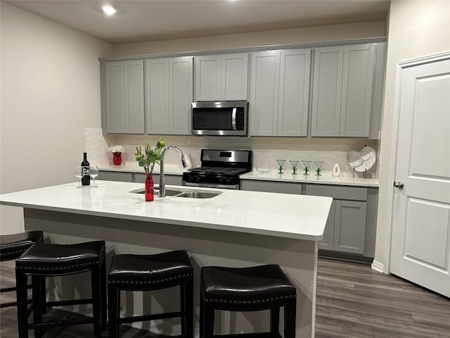 11503 Copperstone Ave Unit 89, Austin, TX 78748 - kitchen with appliances with stainless steel finishes, gray cabinetry, tasteful backsplash, and recessed lighting